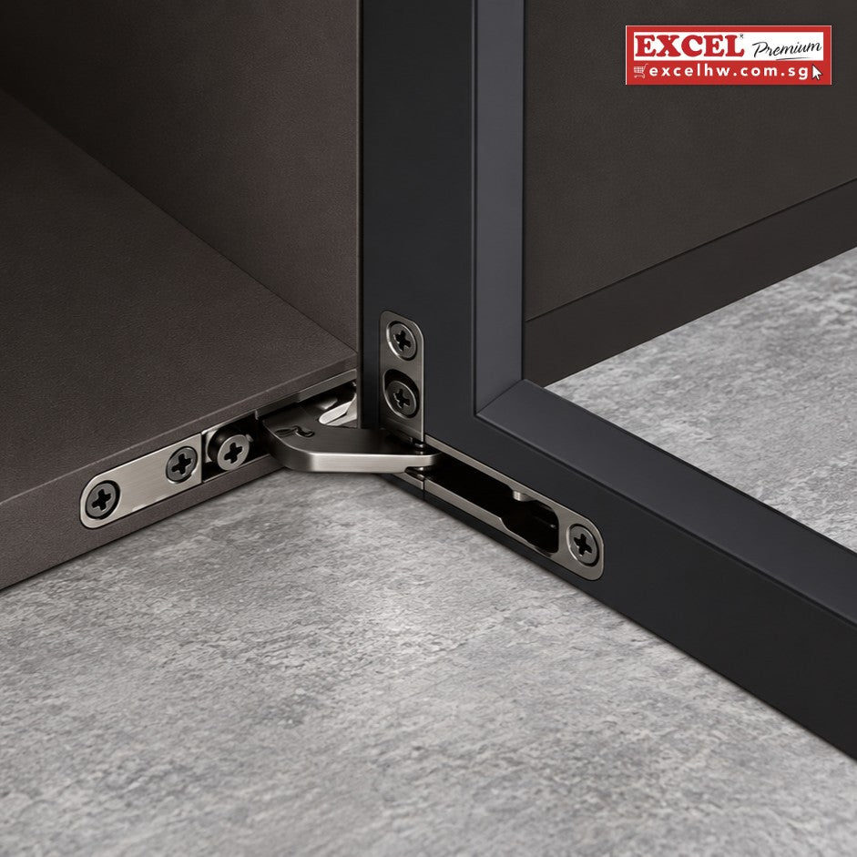 Girova concealed hinge fitted at the top corner of a cabinet door, joining the door frame to the cabinet