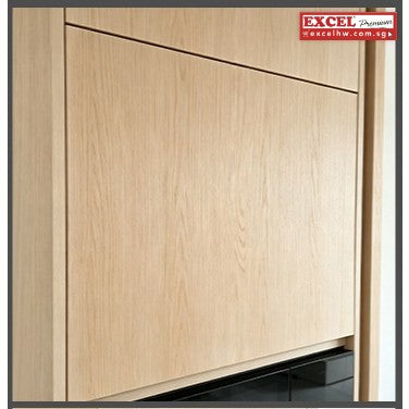 Light oak tall cabinet with flush flap door closed, giving a clean seamless front