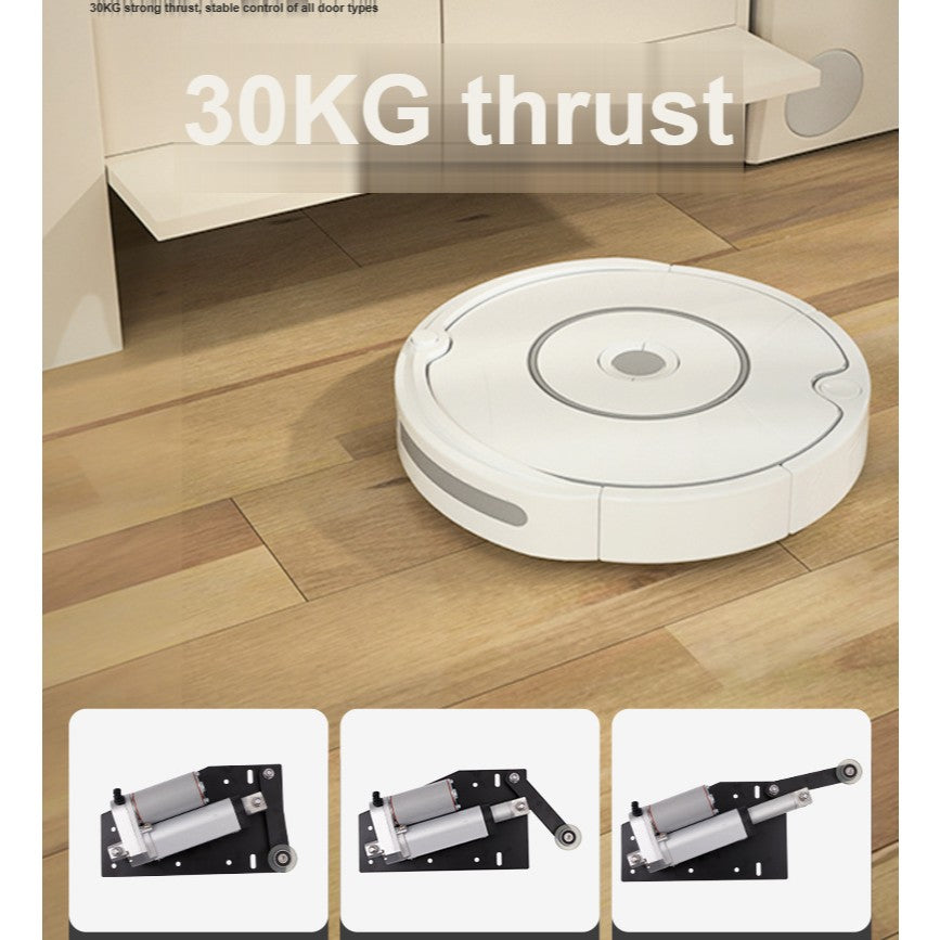 Robot vacuum cleaner approaching a cabinet whose bottom kick panel has opened automatically