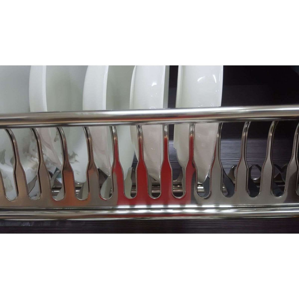 Close-up of Cipriana plate rack slots holding white plates
