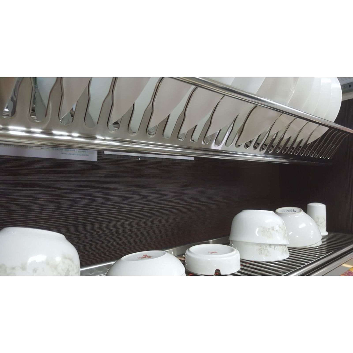 Cipriana dish rack with plates on the upper tier and bowls on the lower tier